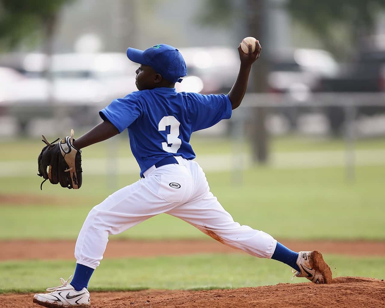 boy-wearing-blue-and-white-3-jersey-about-to-pitch-a-209975