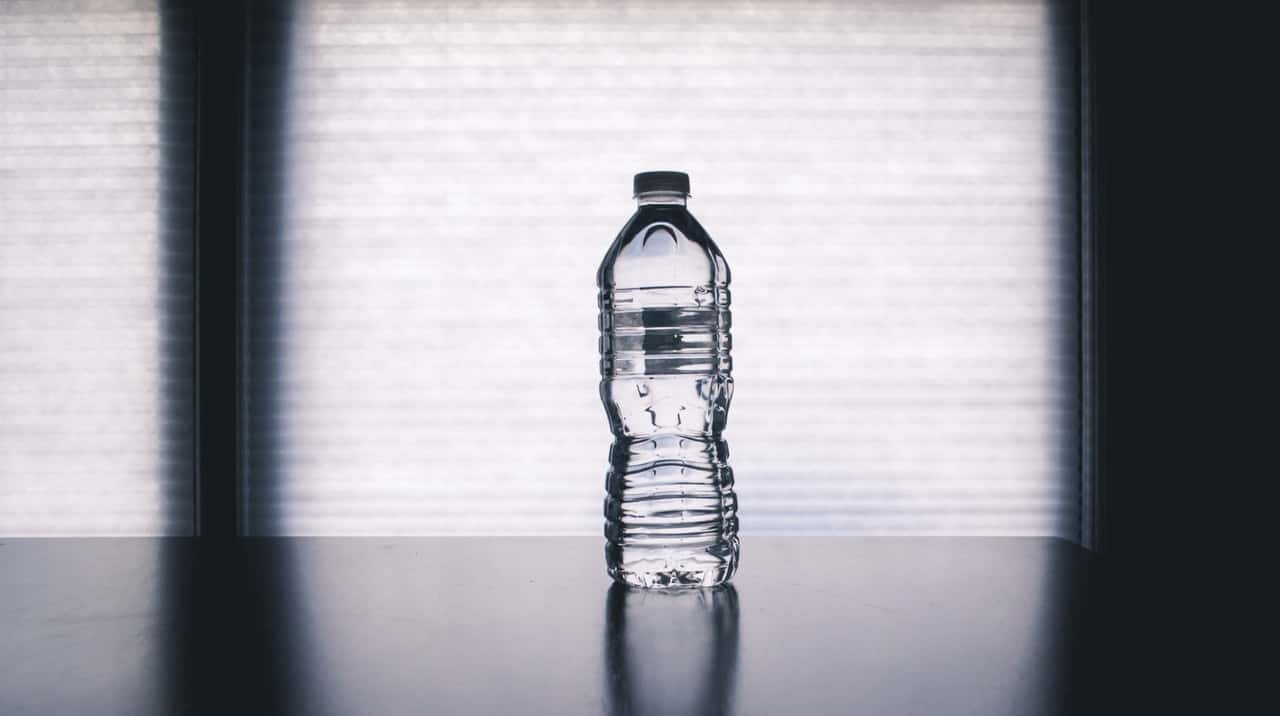 clear-disposable-bottle-on-black-surface-1000084