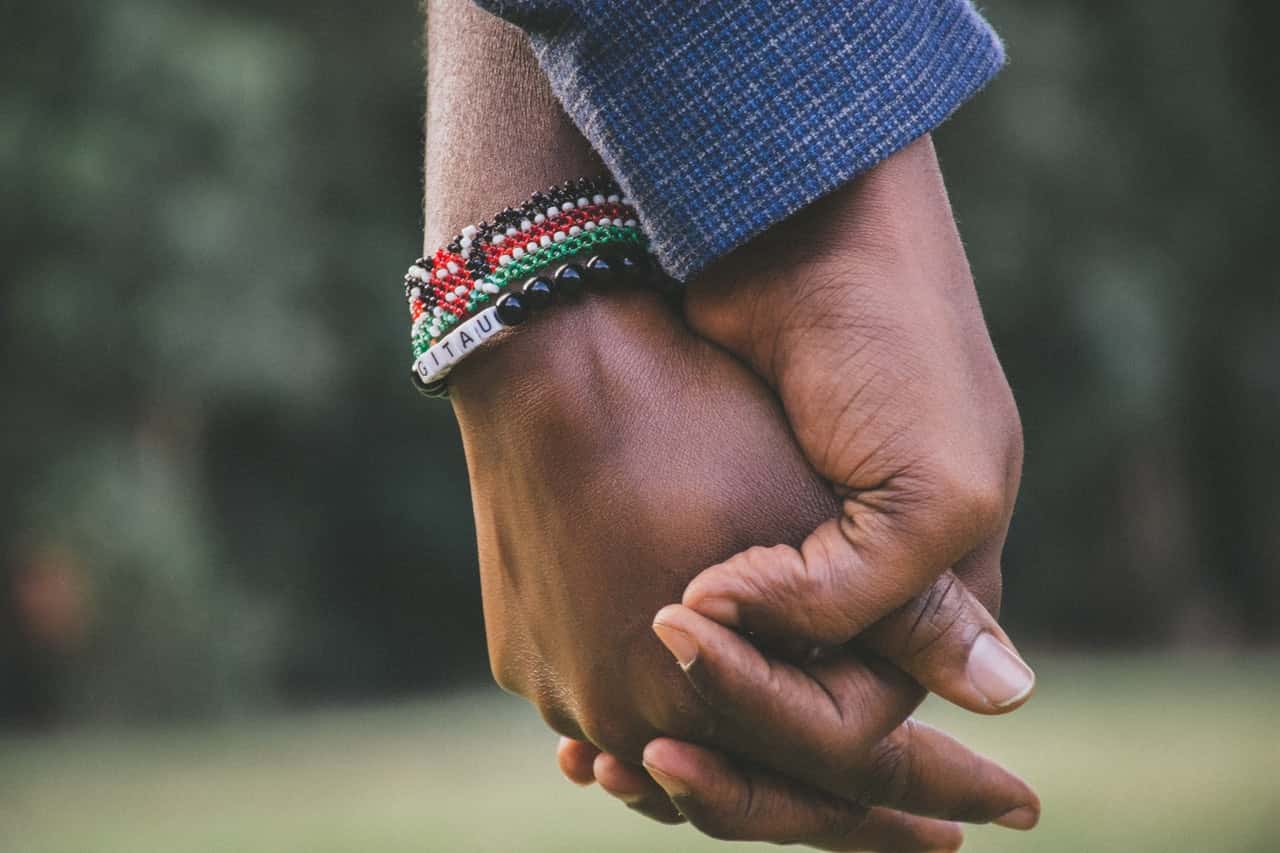 close-up-photo-of-two-person-s-holding-hands-1667849