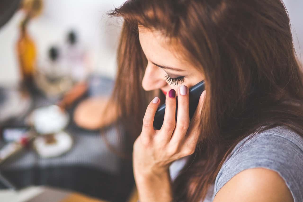 closeup-portrait-of-young-lady-talking-on-mobile-phone-6386
