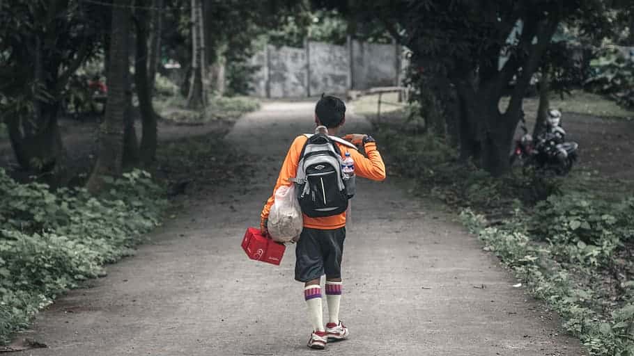 kid-forest-backpack-walking