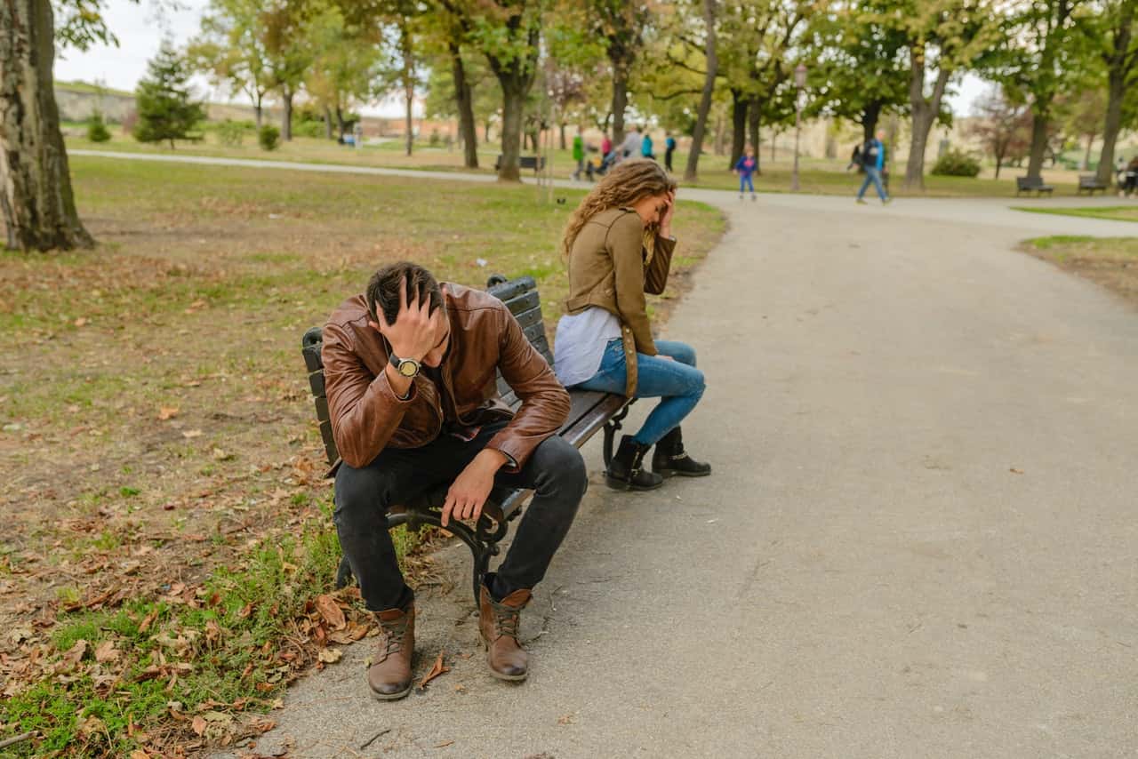 man-and-woman-sitting-on-bench-984953