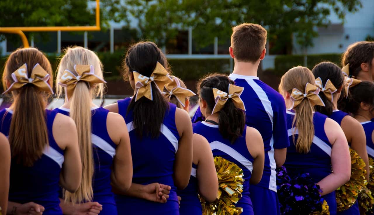 photo-of-cheerleaders-in-blue-and-white-uniform-685379
