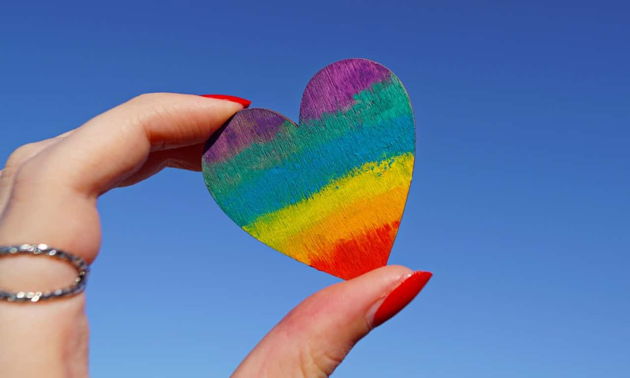 photo-of-person-holding-multicolored-heart-decor-1173576
