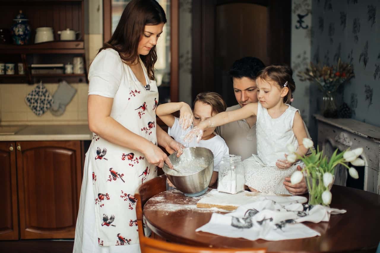photo-of-woman-baking-near-her-family-3807216