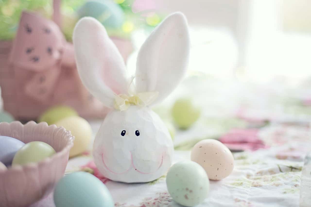 white-rabbit-figurine-on-white-and-pink-floral-textile-3979241