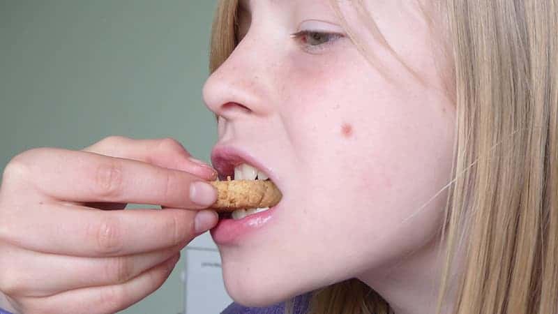 woman-eating-bread-with-cheese