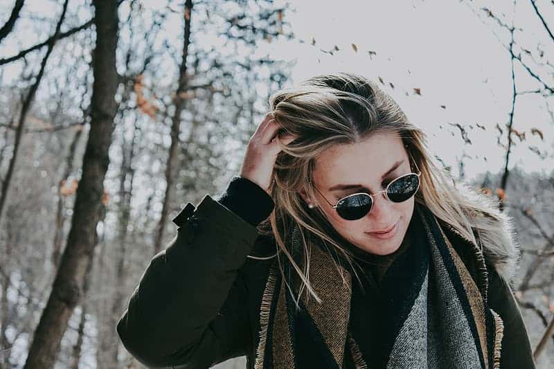 woman-in-black-coat-and-black-aviator-style-sunglasses