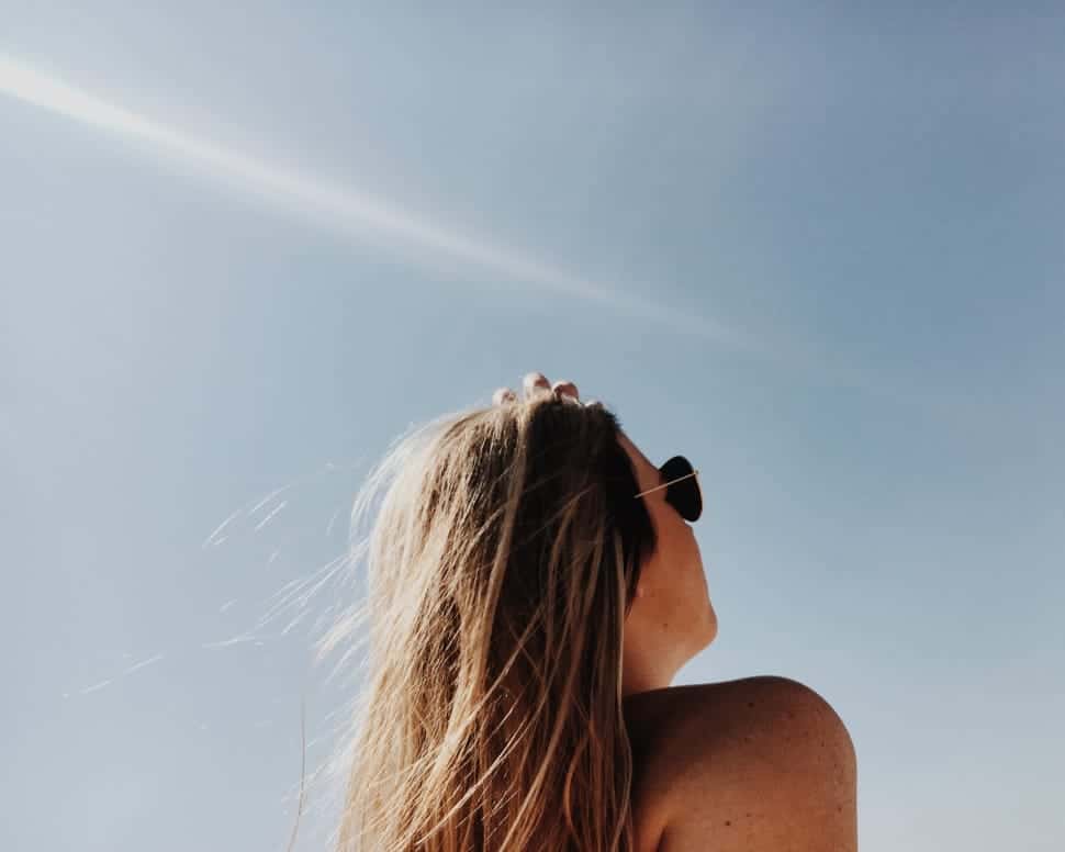 woman-wearing-black-sunglasses-sitting-watching-sky-wallpaper-preview