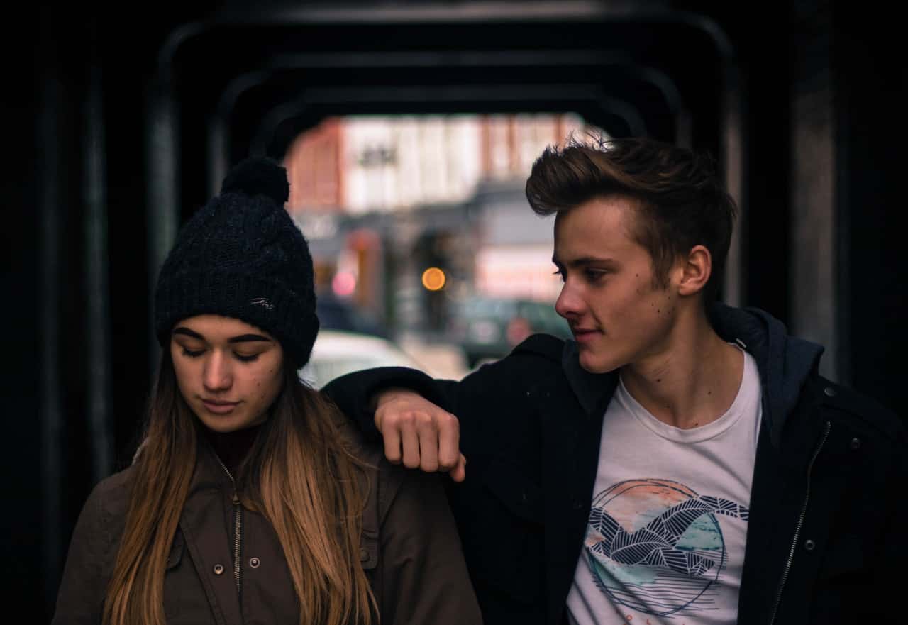 young-couple-in-city-at-night-246367