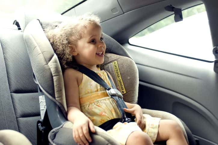 young-cute-female-child-in-back-seat-car-set-725x482