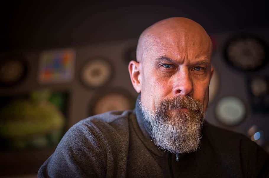 adult-bald-blurred-background-close-up