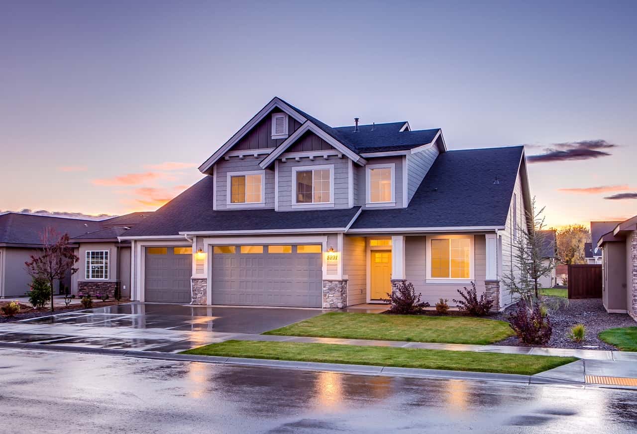 blue-and-gray-concrete-house-with-attic-during-twilight-186077