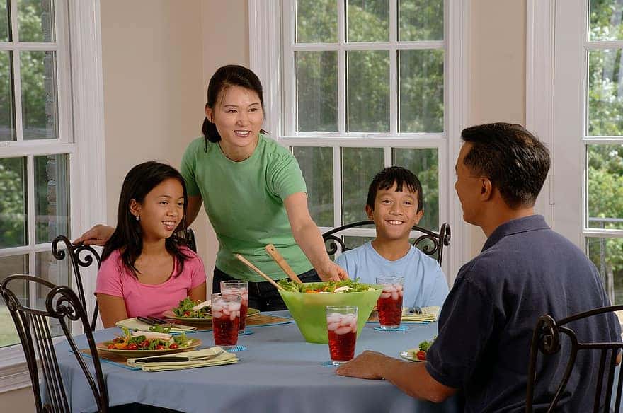family-eating-at-the-table-dining-parents-children-eat-together-son-daughter-mother