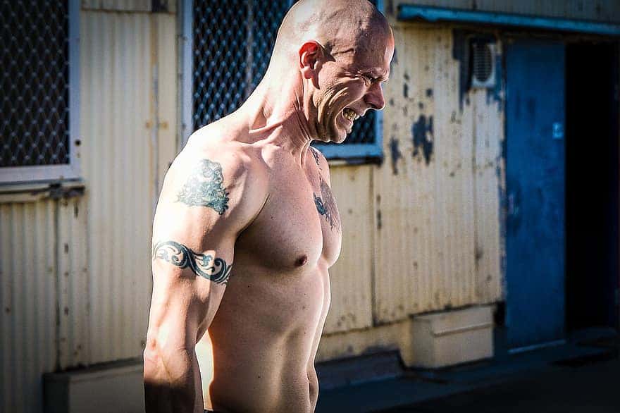 farmer-walks-hardcore-training-gym-fitness-crossfit-pain-sweat-no-shirt