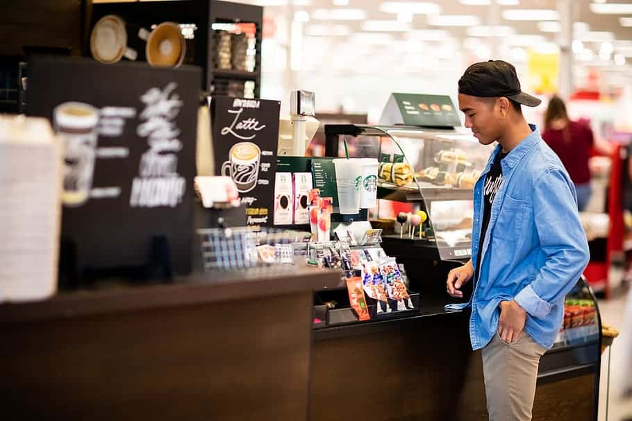 man-standing-in-front-cashier