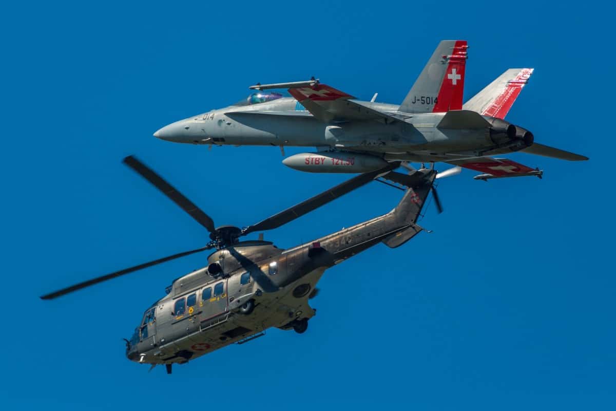 mcdonnell_douglas_f_a_18_hornet_aircraft_a_rospatiale_as_332_super_puma_helicopter-618255