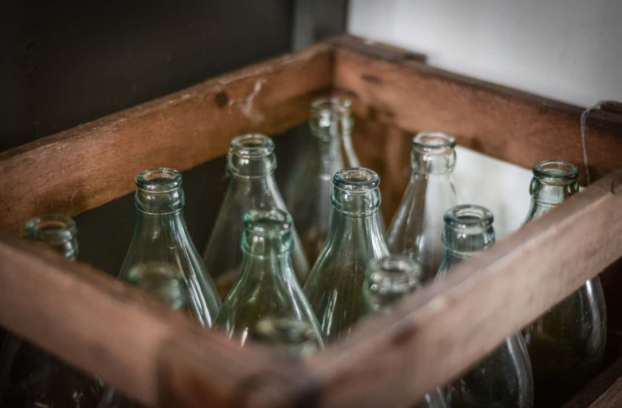 photo-of-bottles-inside-brown-wooden-crate-1699774