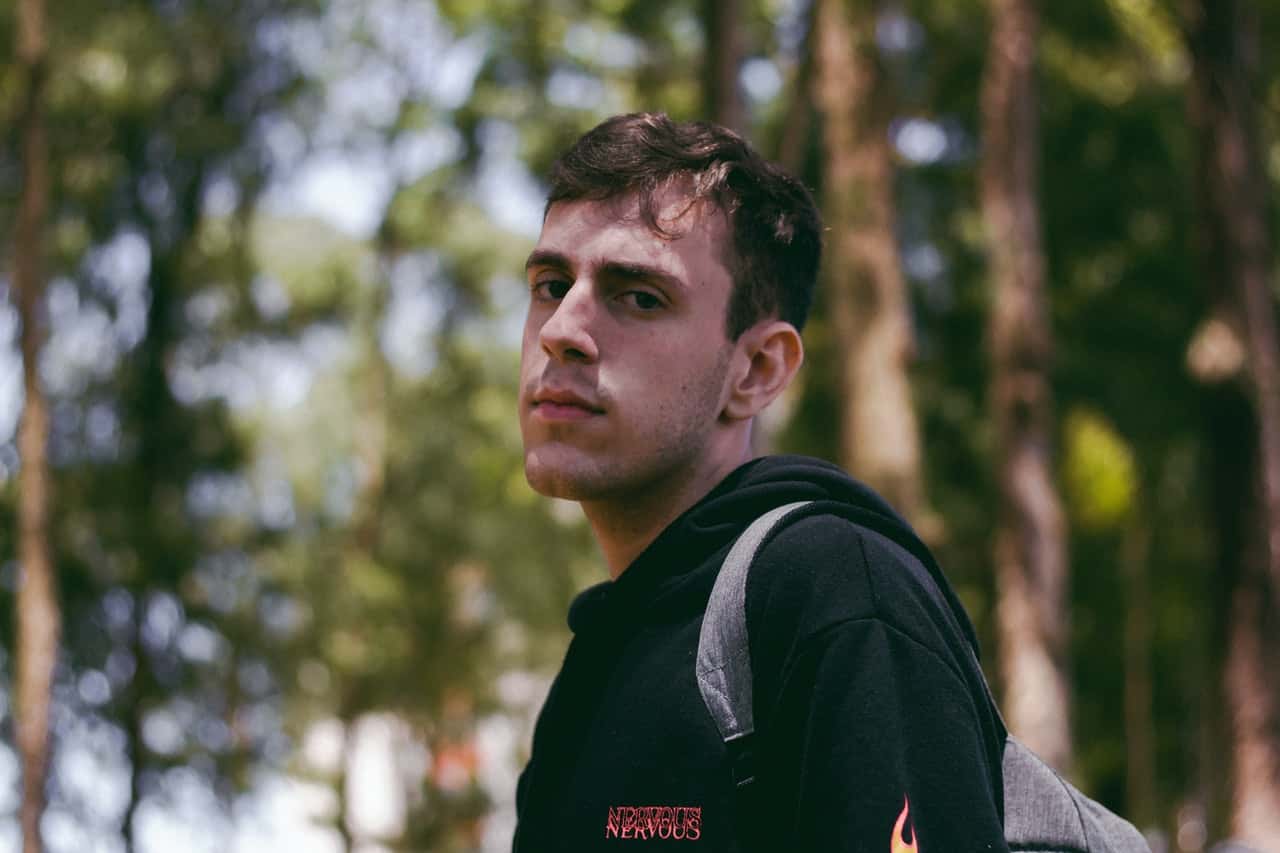 photo-of-man-in-black-hoodie-carrying-backpack-3637528