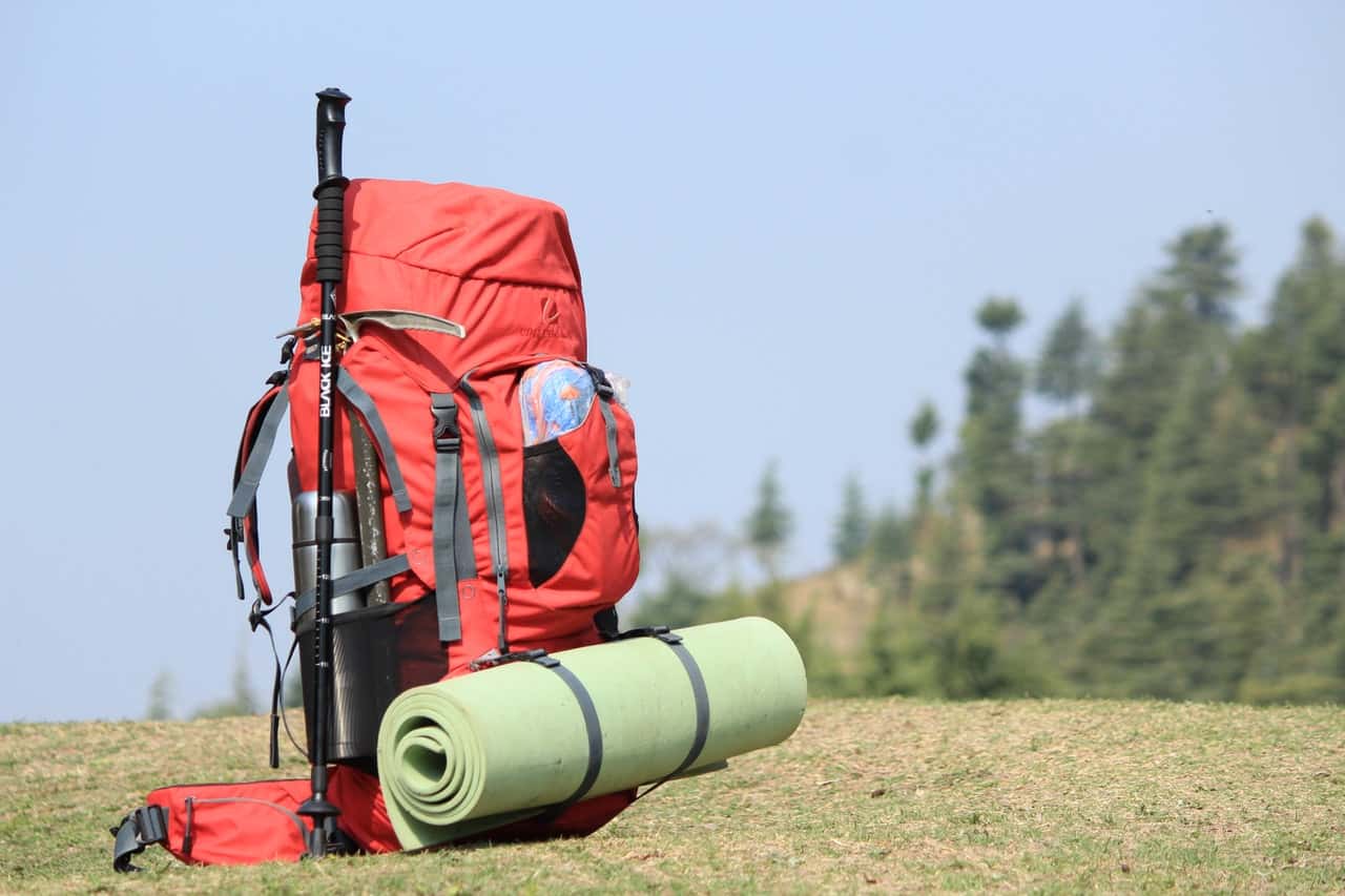 selective-focus-photo-of-red-hiking-backpack-on-green-grass-1294731