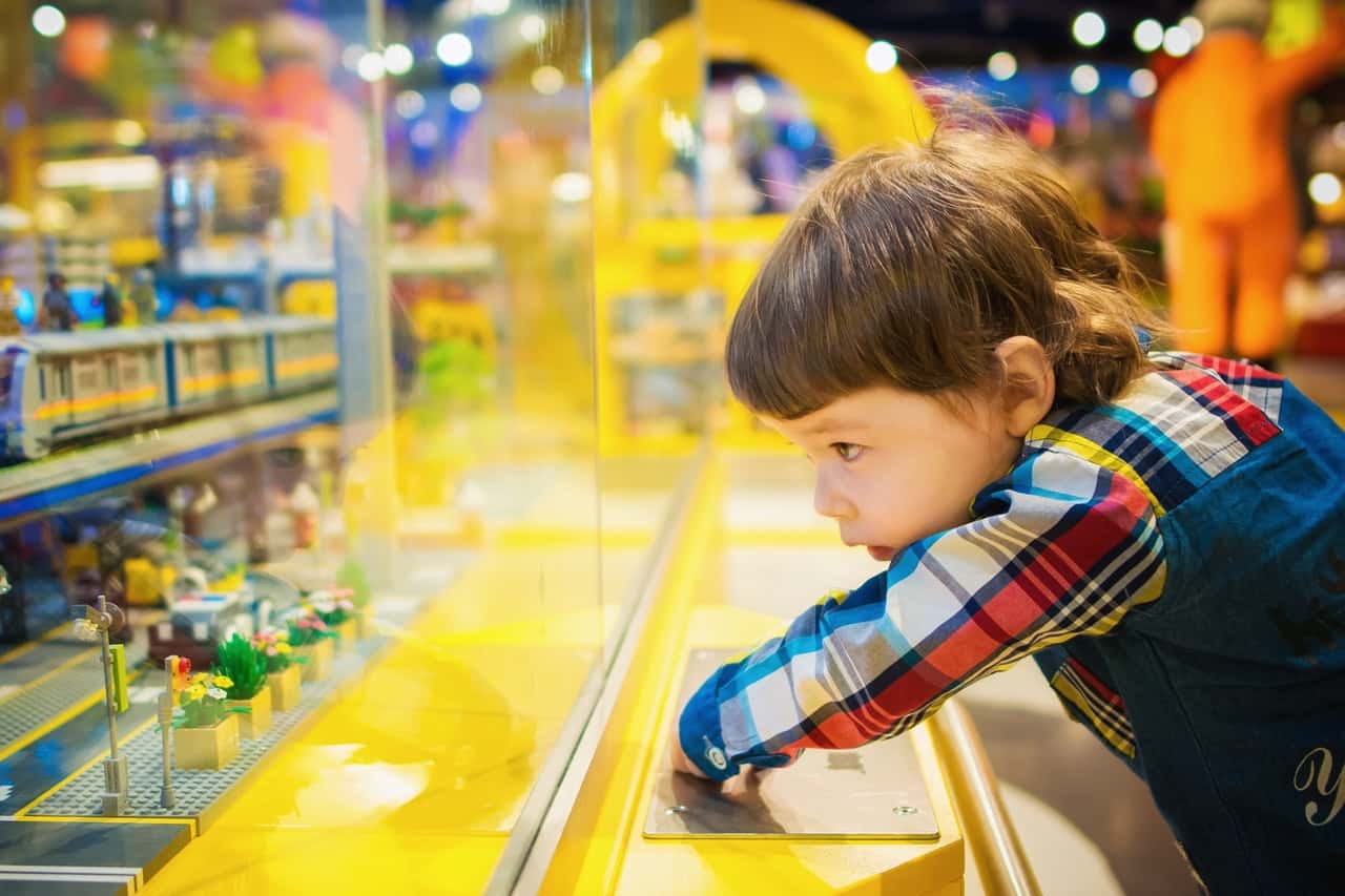 selective-focus-photography-of-toddler-in-front-of-glass-1620675
