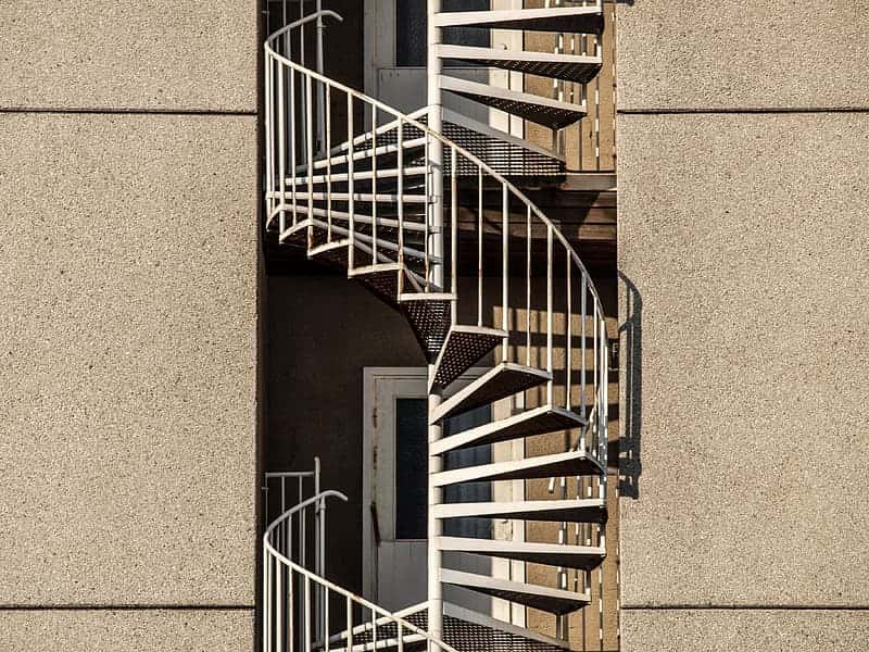 spiral-stairs-between-concrete-buildings