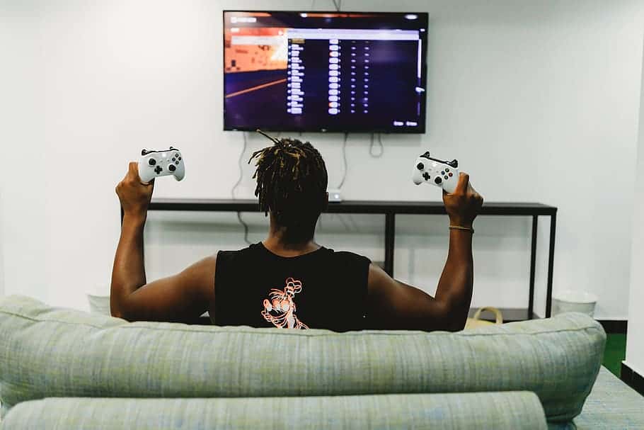 video-game-joystick-man-couch-sofa
