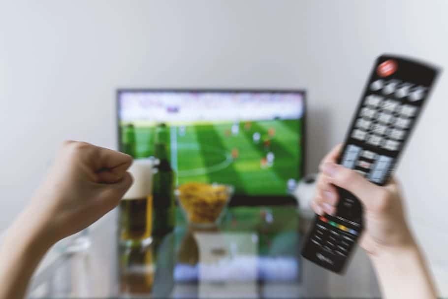 watching-football-match-tv-remote-controller