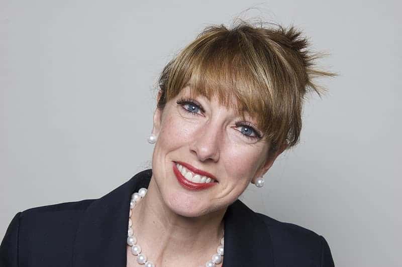 woman-in-black-blazer-taking-picture