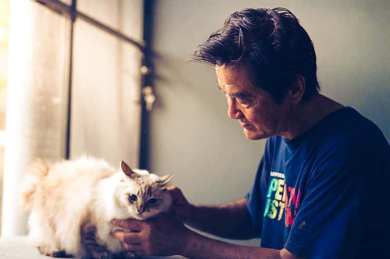 man-holding-cat