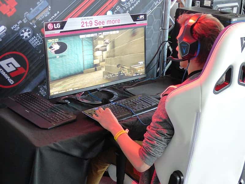 man-sitting-while-playing-online-games