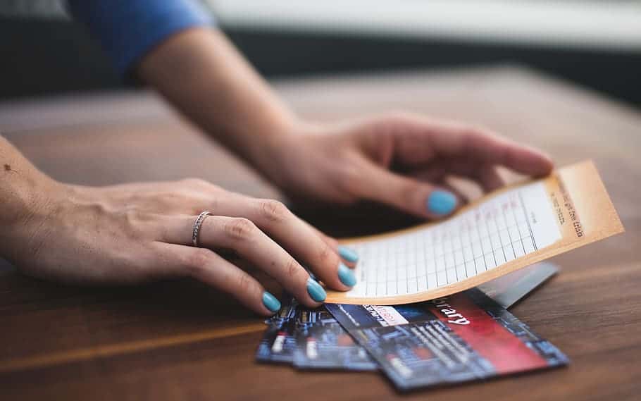 person-reading-card-on-three-tickets