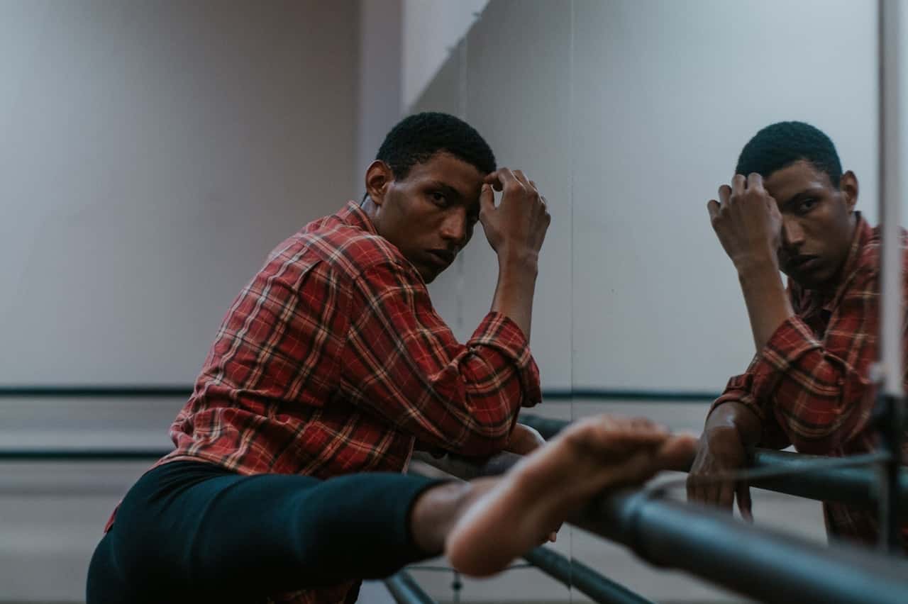 photo-of-man-putting-his-leg-on-handrail-3467384