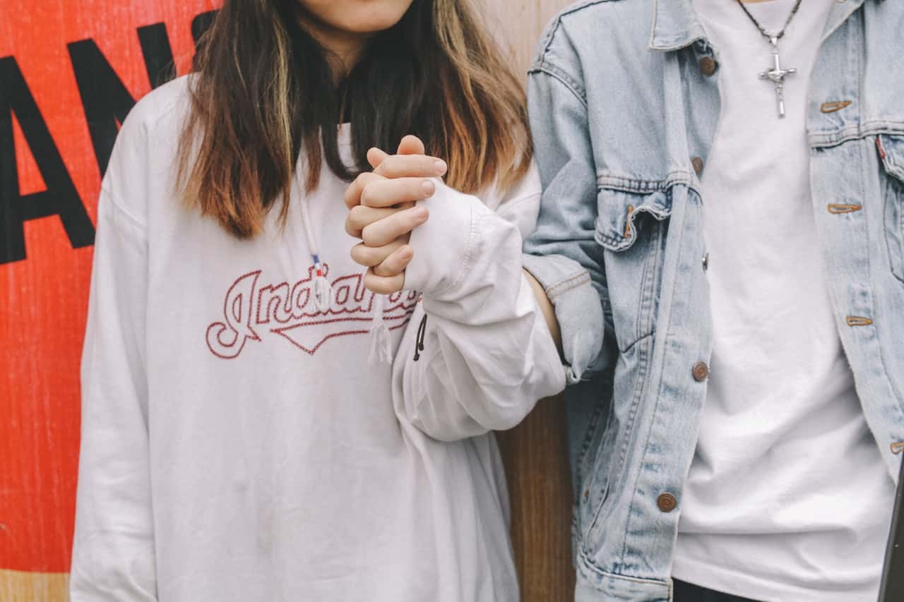 woman-holding-man-s-hand-during-day-773124