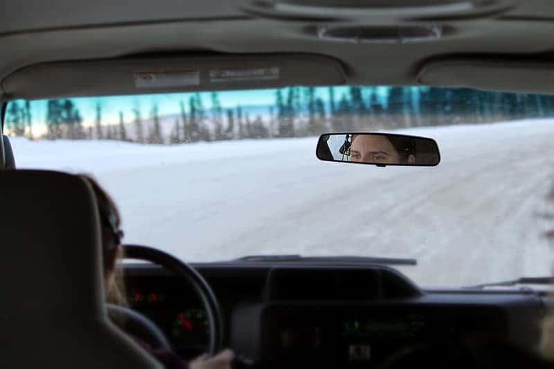 car-on-snow-covered-road-during-daytime