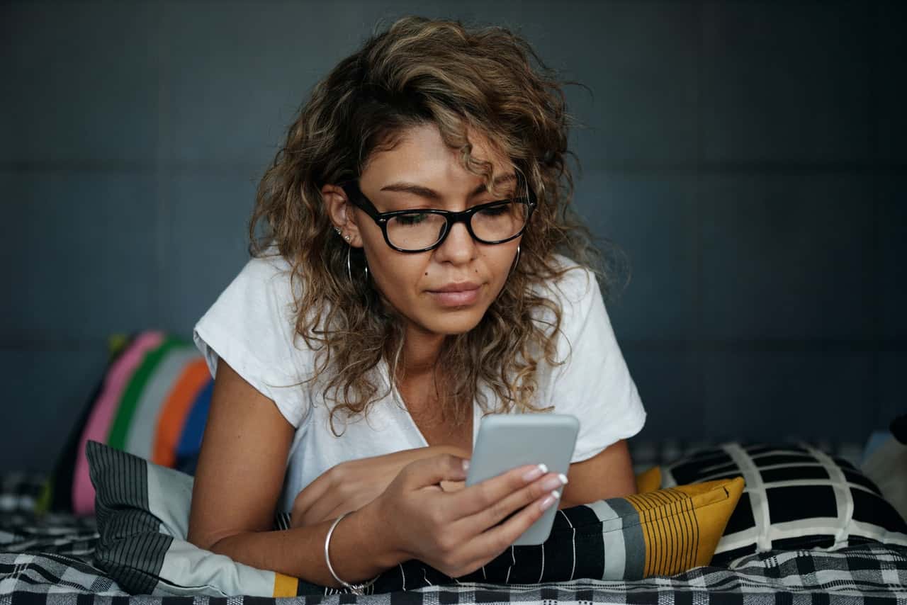 close-up-photo-of-woman-using-her-mobile-phone-4100843
