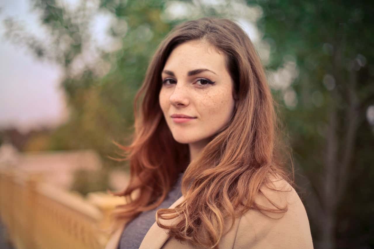 closeup-photo-of-woman-with-brown-coat-and-gray-top-733872