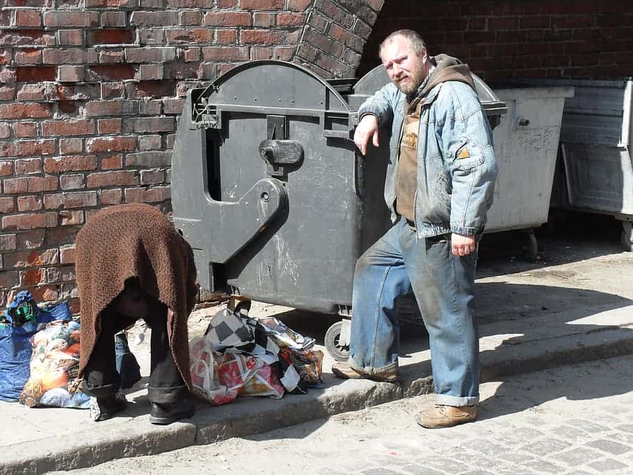 couple-poland-people-homeless-trash-container