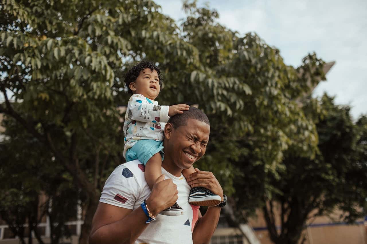 man-carrying-child-1661818