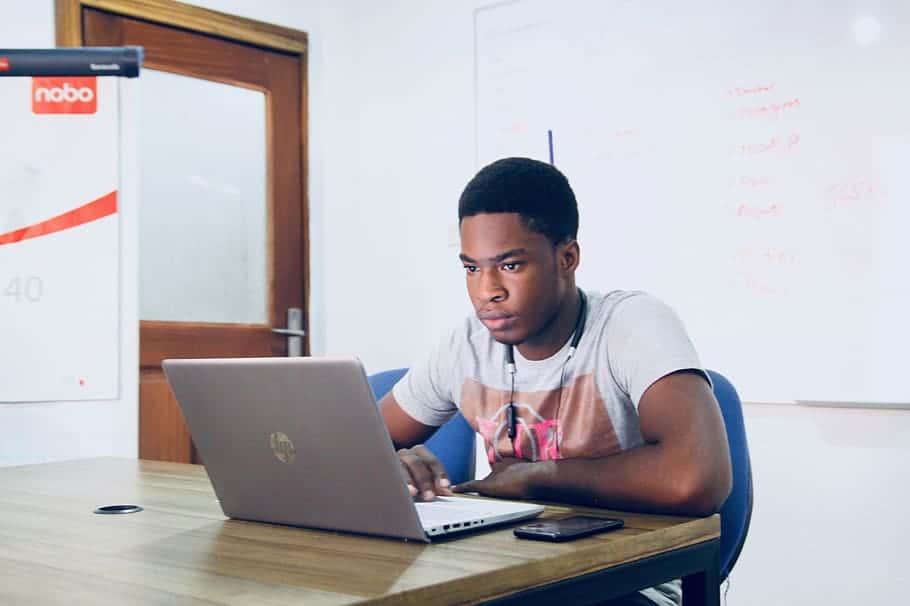 man-in-grey-shirt-using-grey-laptop-computer