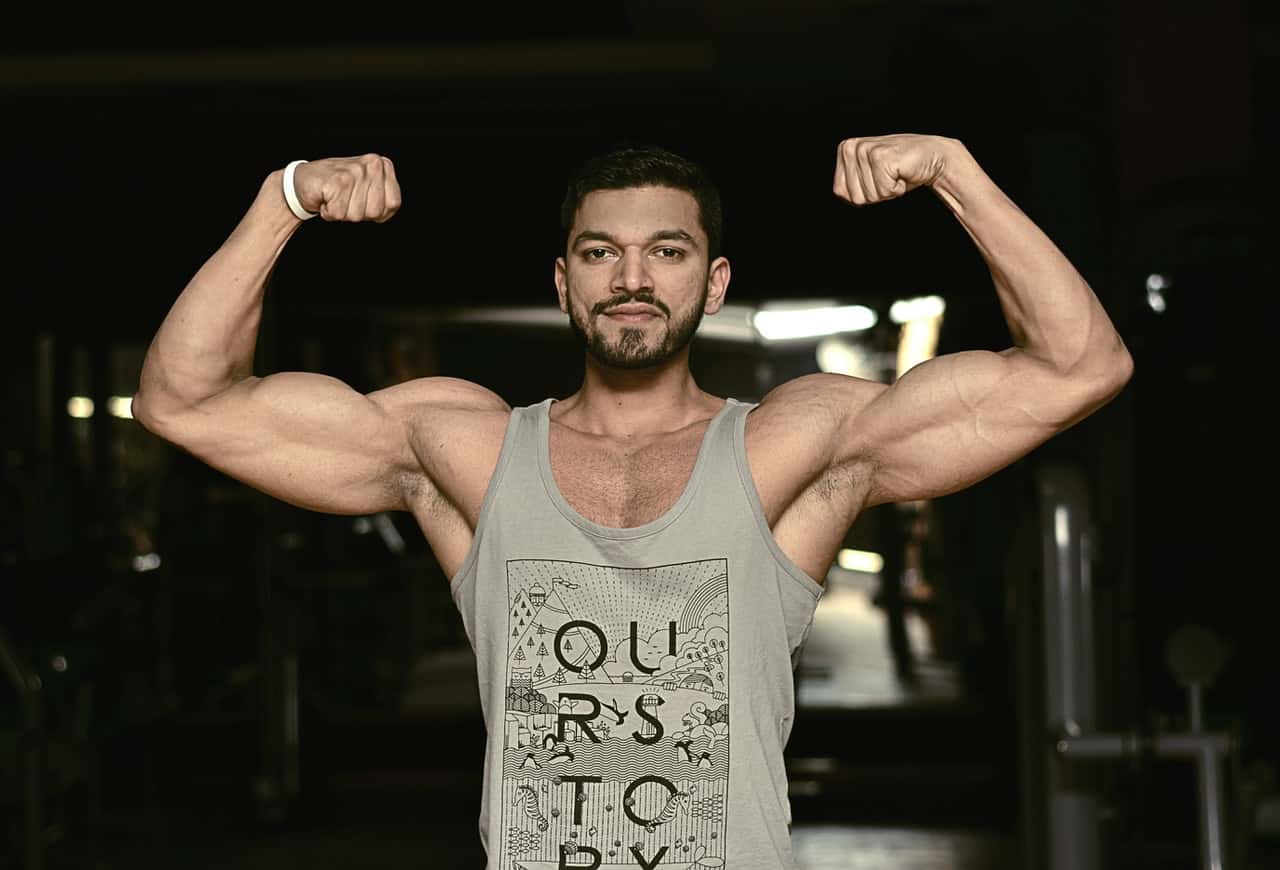 man-wearing-gray-tank-top-1423384