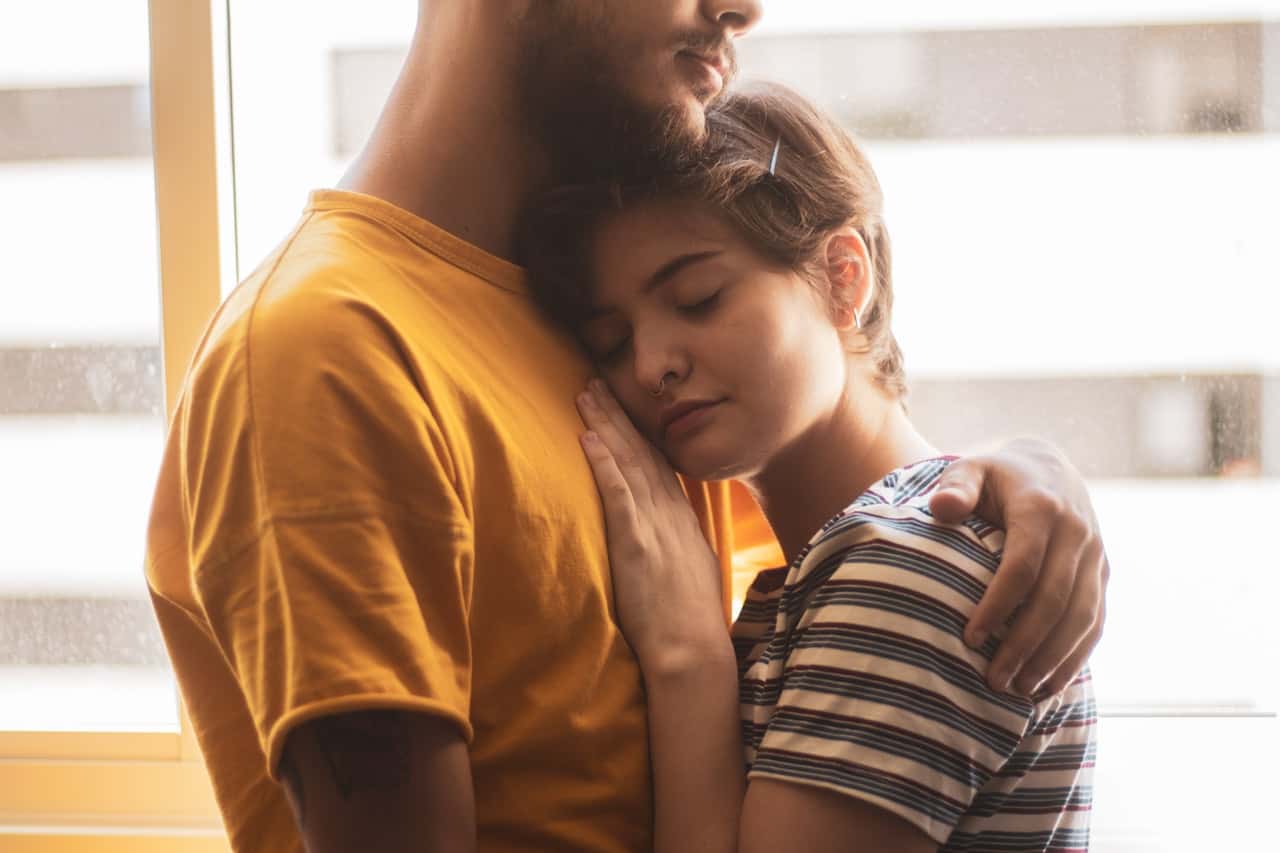 man-wearing-yellow-shirt-holding-woman-wearing-white-and-2311868
