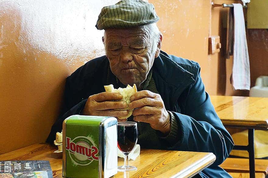 old-generation-80s-senior-old-people-old-man-eating-cafe-bread