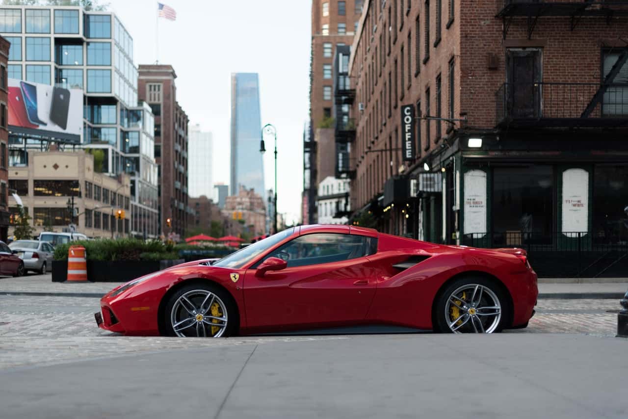 photo-of-ferrari-sports-car-parked-on-road-2664399
