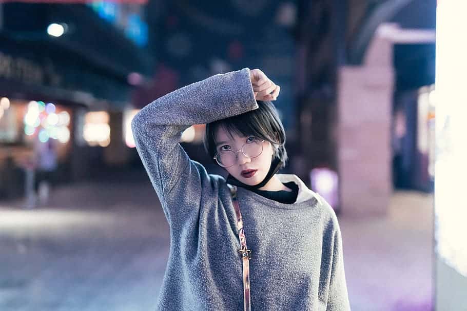 selective-focus-photography-of-standing-woman-wearing-long-sleeved-top