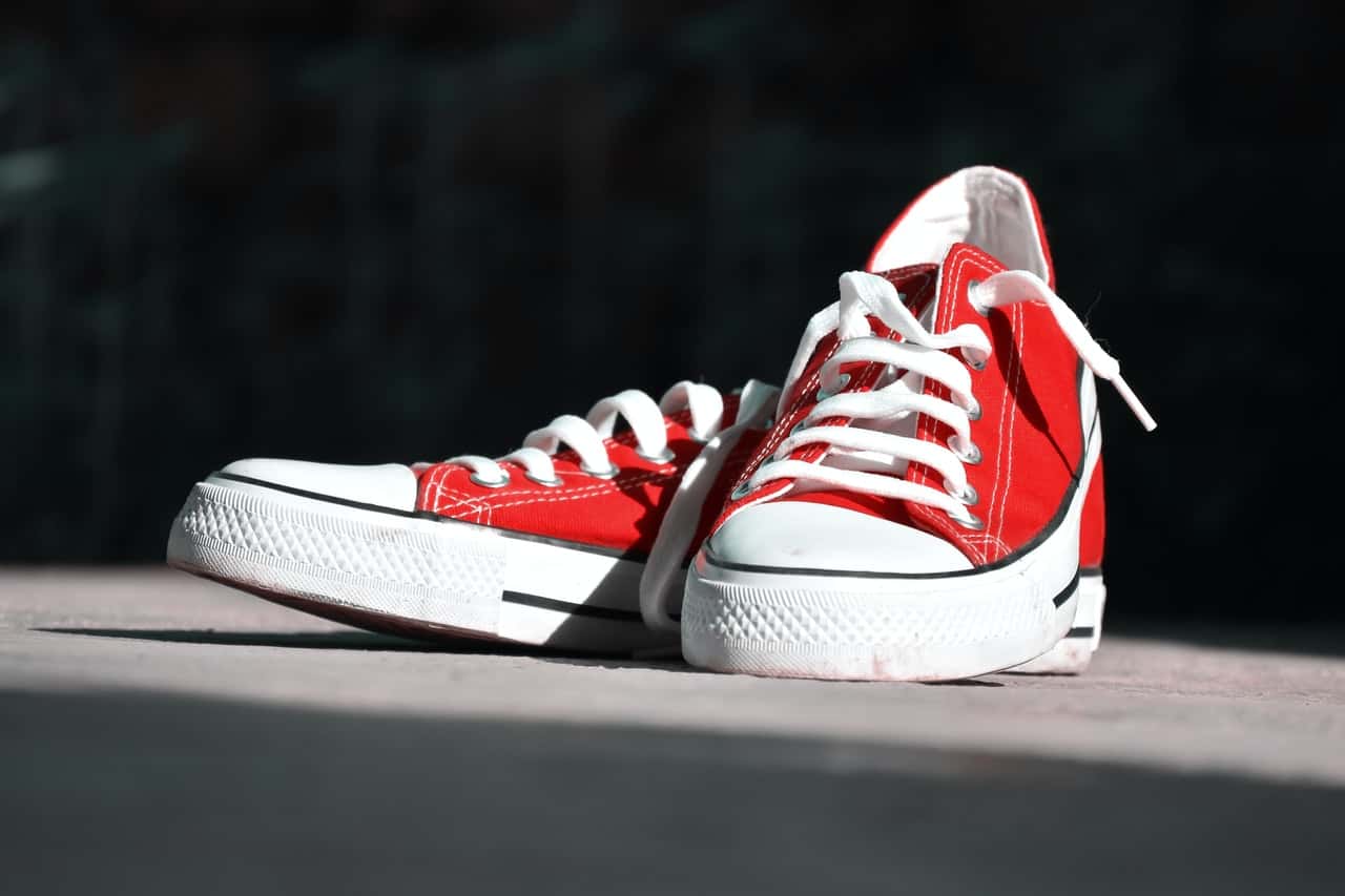 shallow-focus-photography-of-pair-of-red-low-top-sneakers-1240892