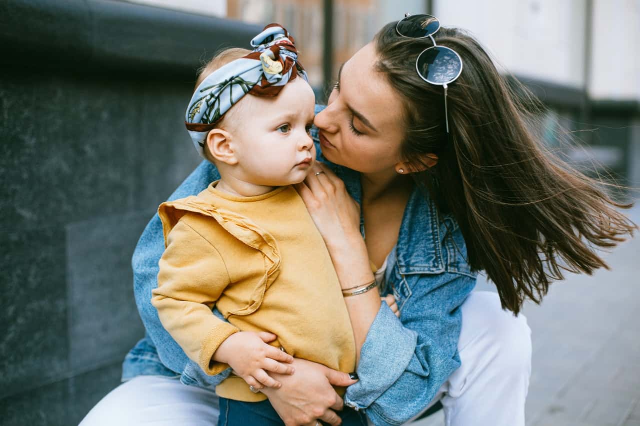 woman-holding-her-baby-girl-3671154