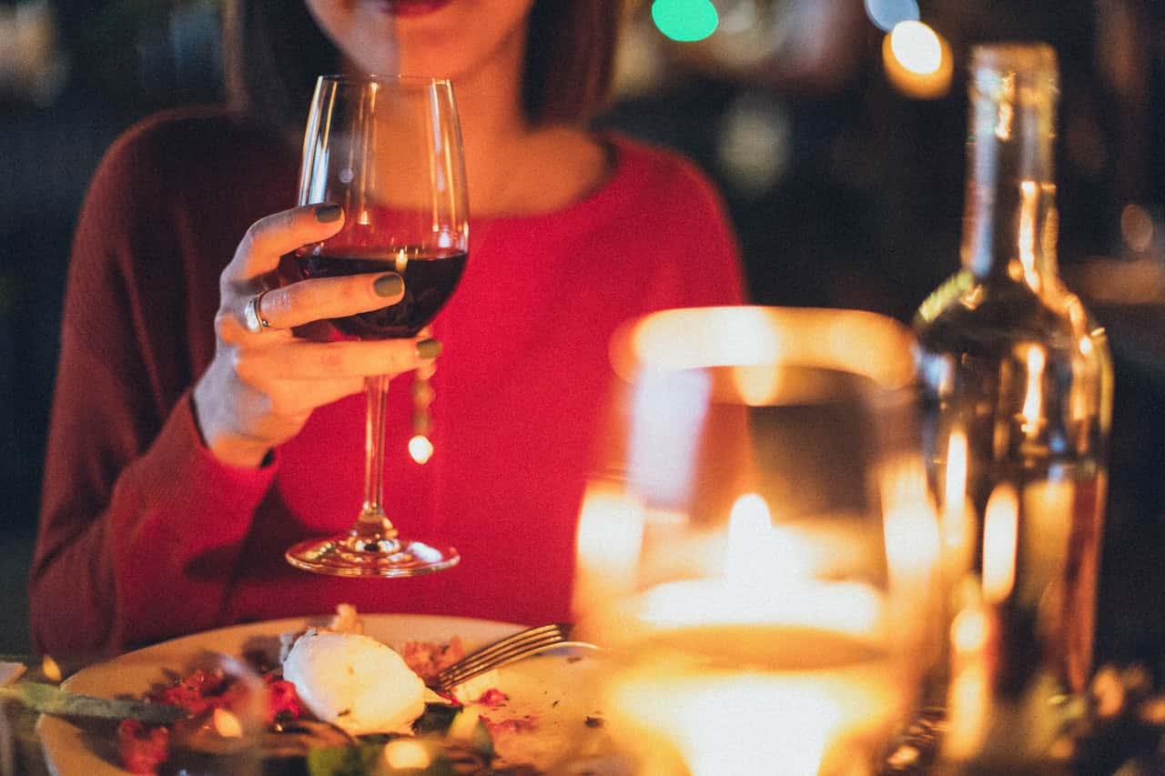 woman-holding-wine-glass-selective-focus-photography-1850595