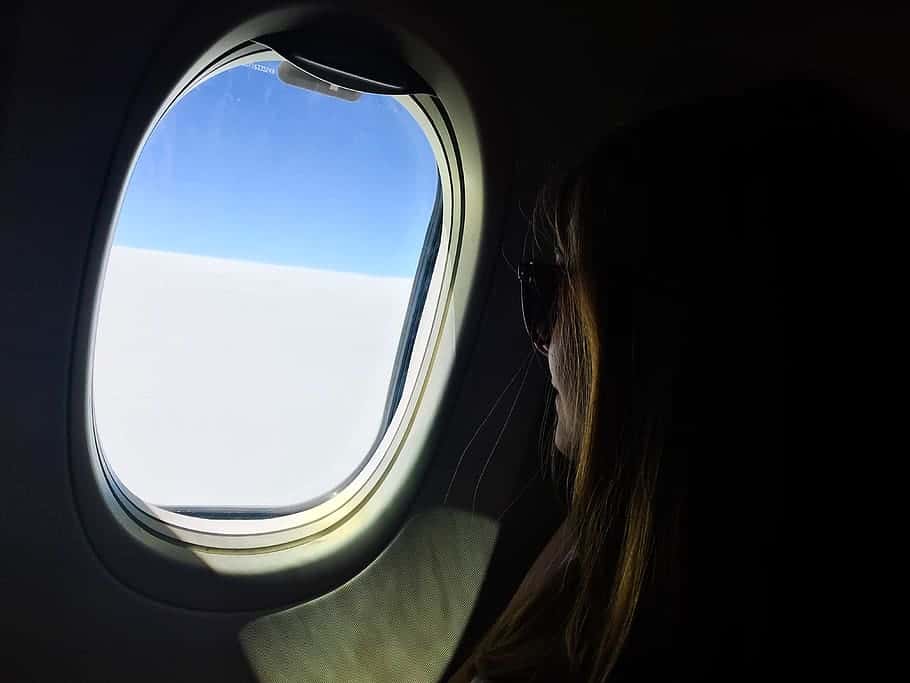 woman-looking-outside-plane-window