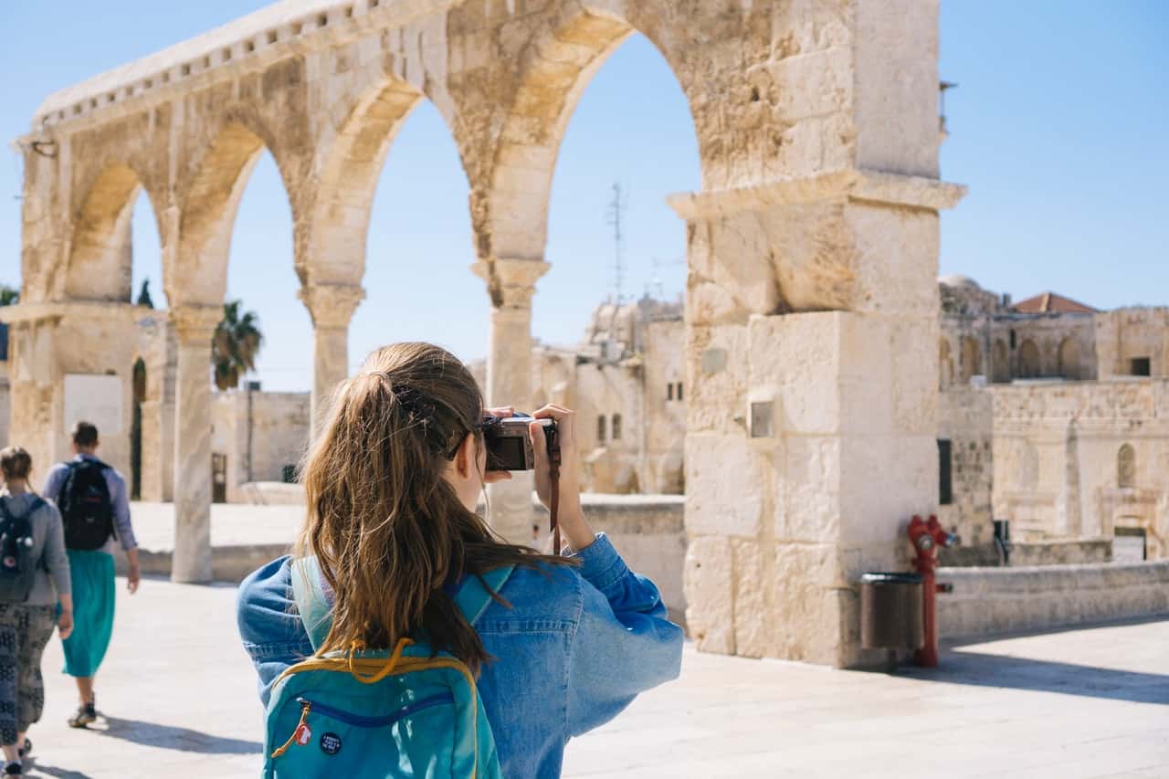 woman-taking-pictures-of-ruins-2087391
